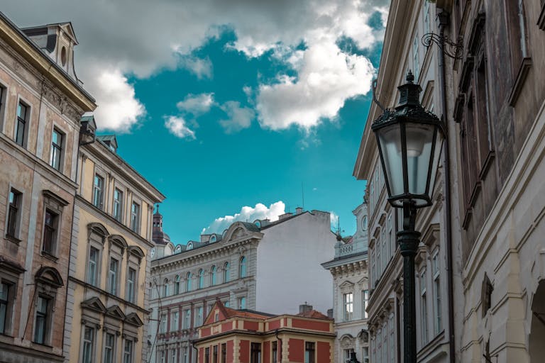 Charming European street scene with historic buildings and classic architecture under a clear sky.